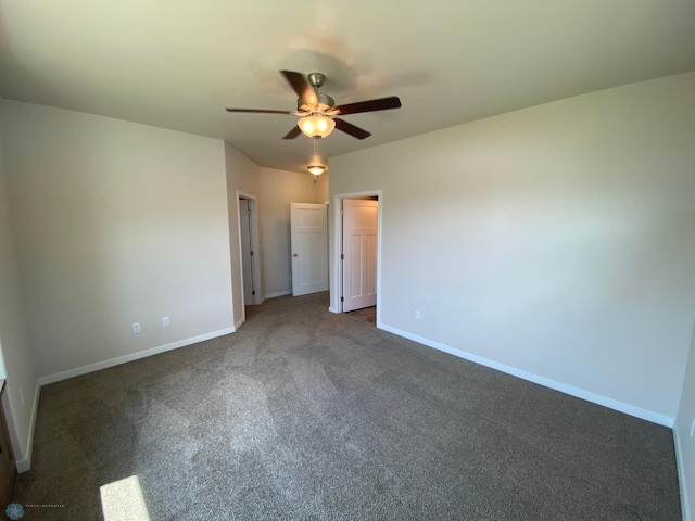 unfurnished bedroom with carpet flooring, baseboards, and ceiling fan
