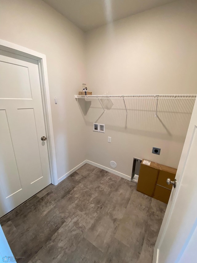clothes washing area featuring hookup for an electric dryer, baseboards, hookup for a washing machine, and wood finished floors