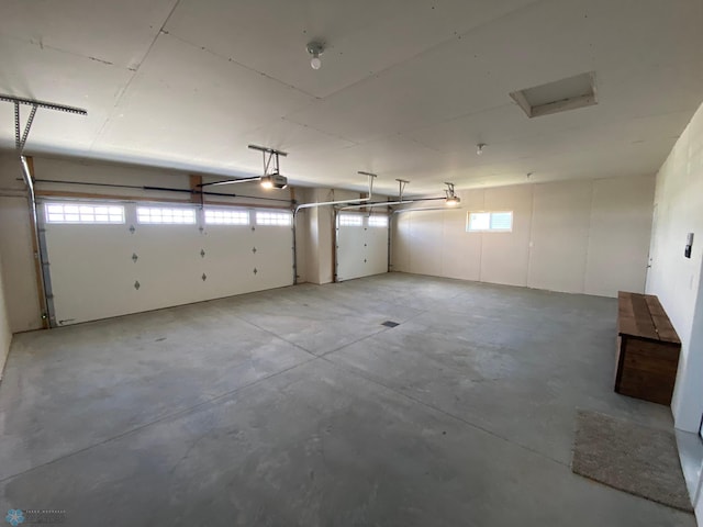 garage featuring a garage door opener