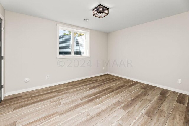 empty room featuring light hardwood / wood-style flooring