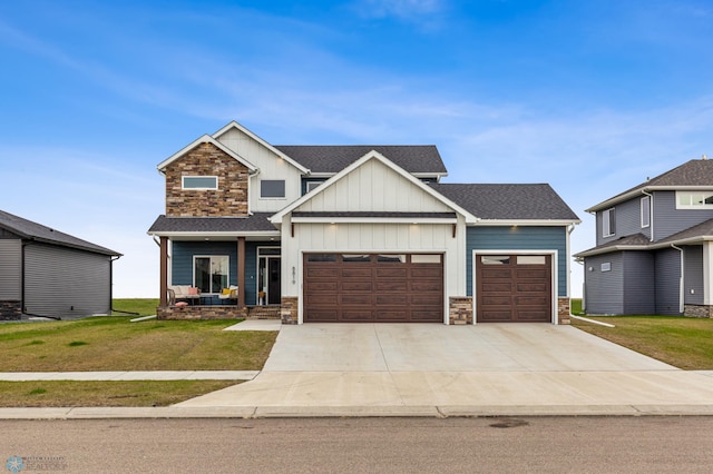 craftsman-style house featuring roof with shingles, a porch, an attached garage, stone siding, and a front lawn