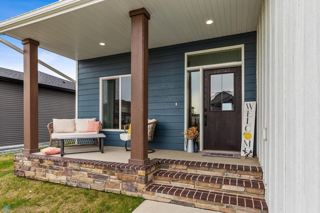 doorway to property featuring a porch