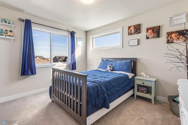 carpeted bedroom with baseboards