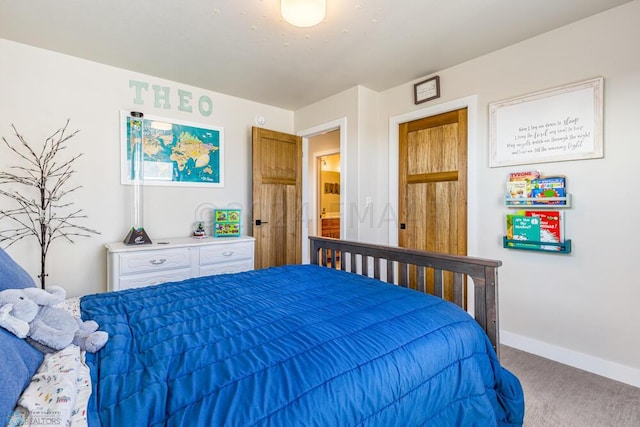 bedroom with baseboards and carpet floors