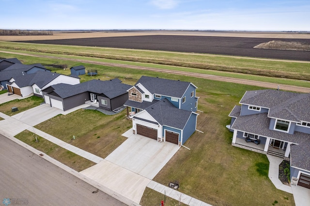 birds eye view of property featuring a residential view and a rural view
