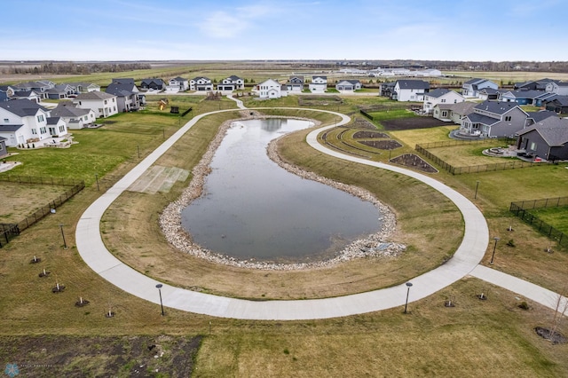 birds eye view of property with a residential view and a water view