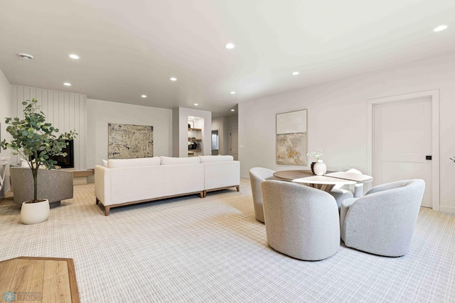 carpeted living room with baseboards and recessed lighting