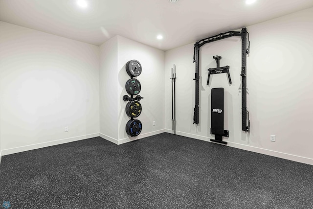 workout area featuring baseboards and recessed lighting