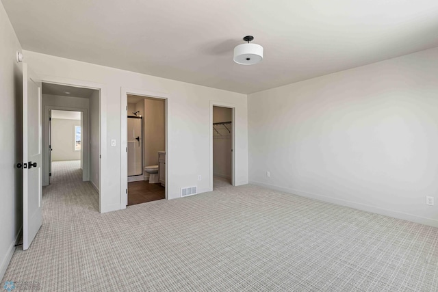 unfurnished bedroom with visible vents, baseboards, and carpet floors