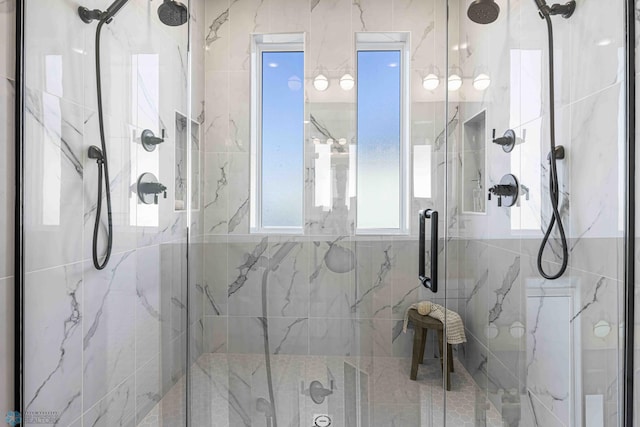 full bath featuring a marble finish shower