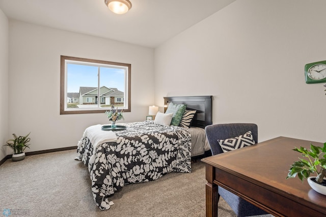 bedroom featuring carpet floors and vaulted ceiling