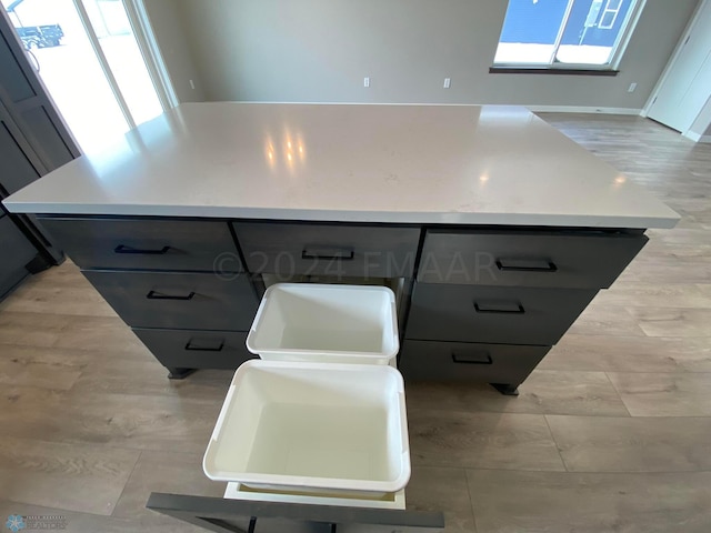 kitchen with a center island and gray cabinets