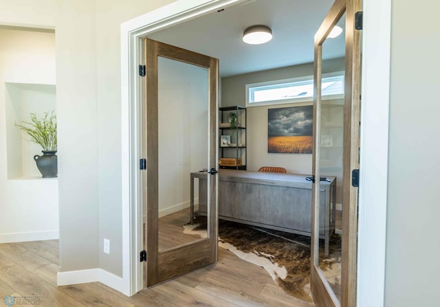 bathroom with hardwood / wood-style flooring