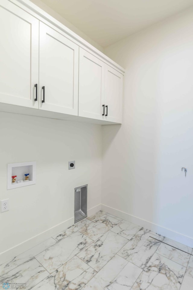 washroom with hookup for a washing machine, hookup for an electric dryer, and cabinets