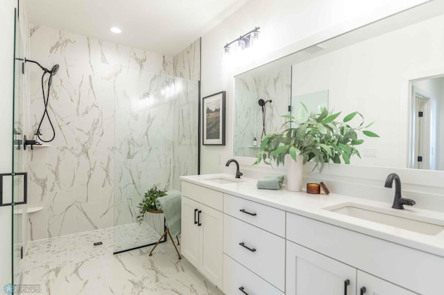 bathroom with vanity and a shower with shower door