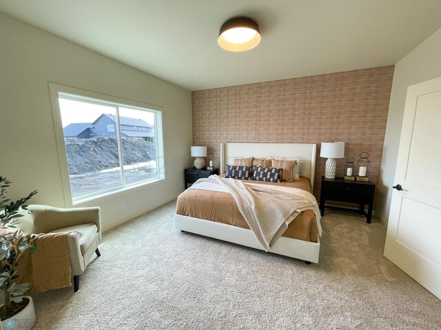 bedroom with light carpet