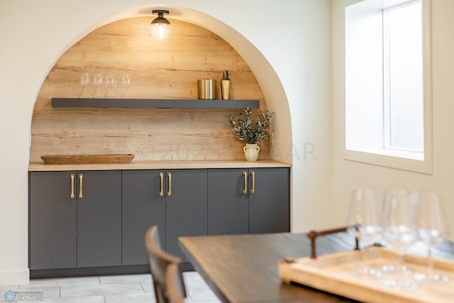 bar featuring gray cabinets