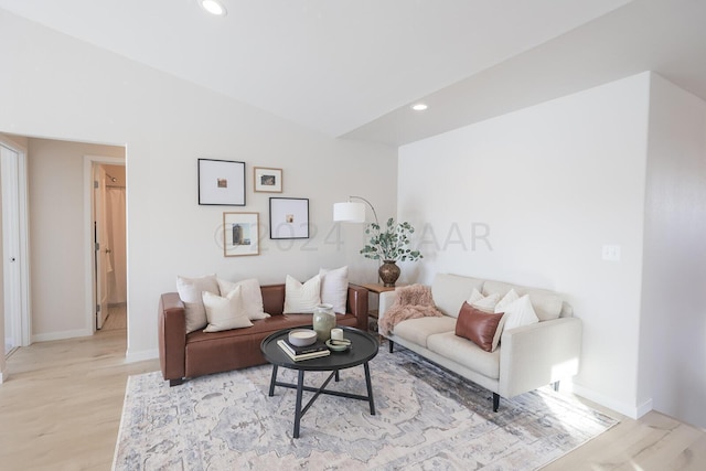 living room with light hardwood / wood-style flooring