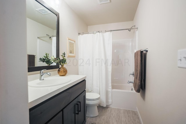 full bathroom with shower / bath combo, tile floors, toilet, and oversized vanity