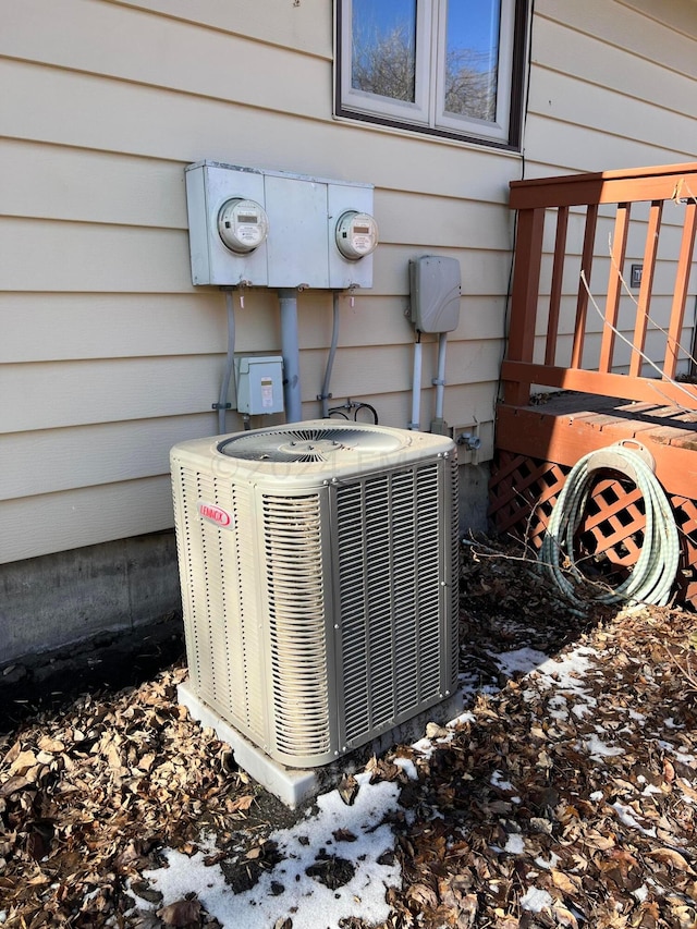 exterior details with electric meter and central AC