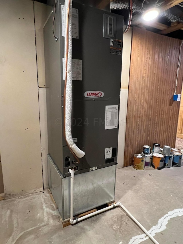 utility room with heating unit