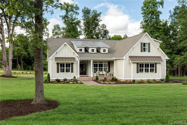 modern farmhouse with a porch and a front yard