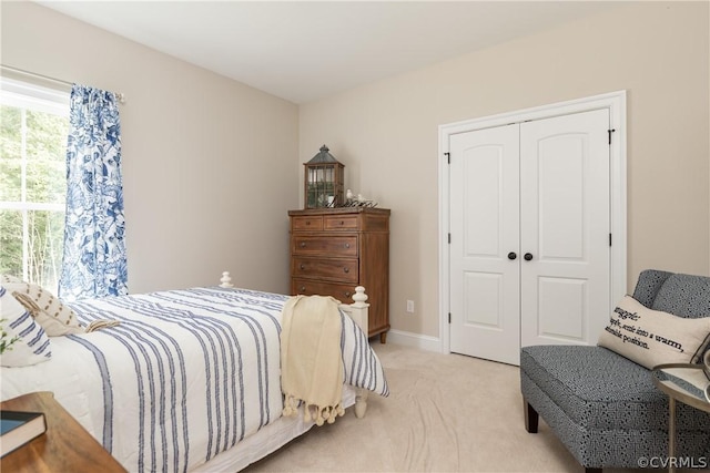 carpeted bedroom with a closet