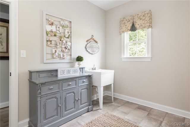 bathroom with tile flooring and vanity