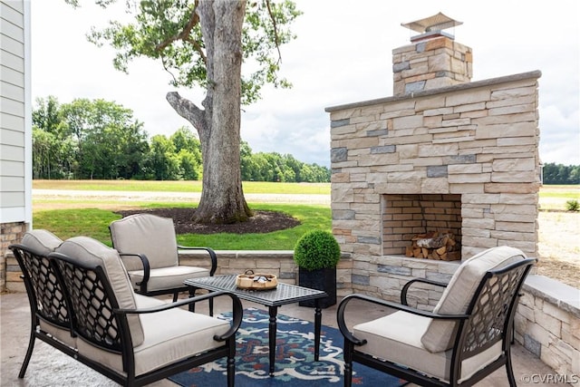 view of patio / terrace featuring an outdoor living space with a fireplace