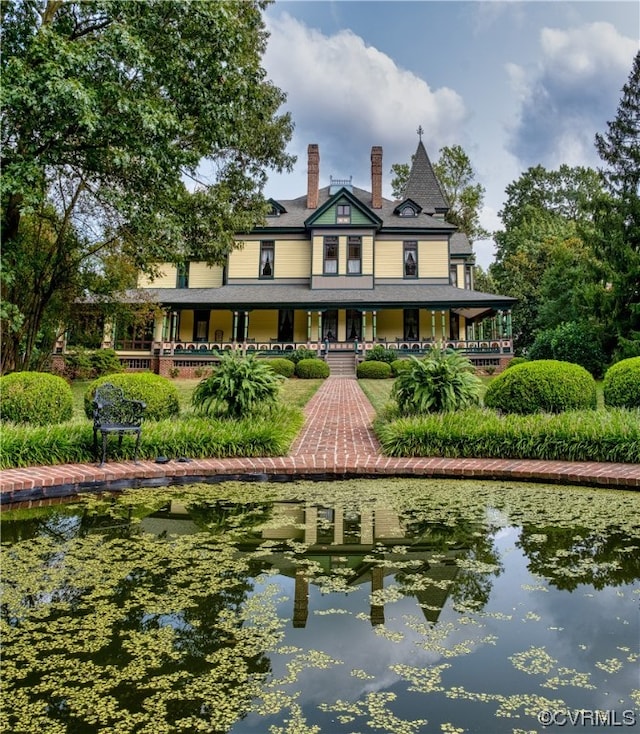 rear view of property with a chimney