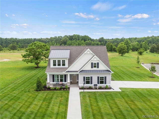 craftsman inspired home with a front lawn and covered porch