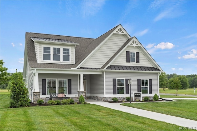 craftsman-style house featuring a front lawn and a porch