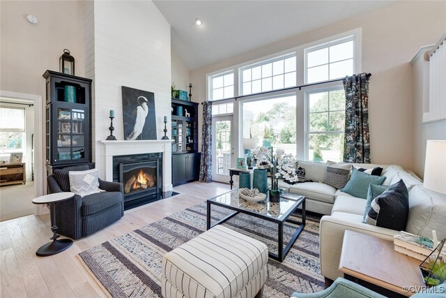 15913 Maclear Dr, Midlothian, VA 23112 - living room featuring high vaulted ceiling, wood finished floors, a fireplace with flush hearth, and recessed lighting