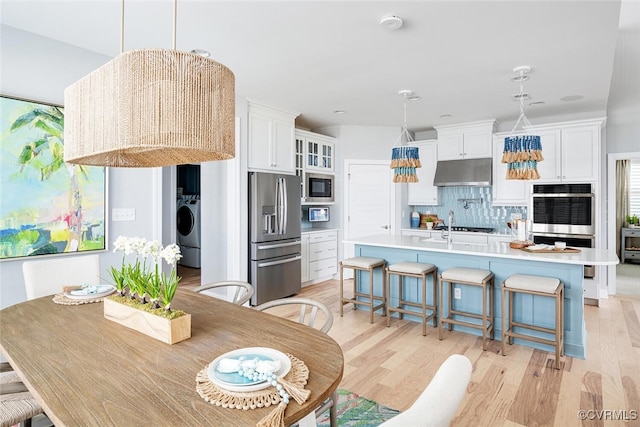 15913 Maclear Dr, Midlothian, VA 23112 - dining space featuring washer / clothes dryer and light wood finished floors