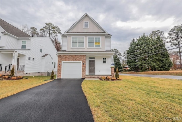 view of front facade with a garage and a front lawn