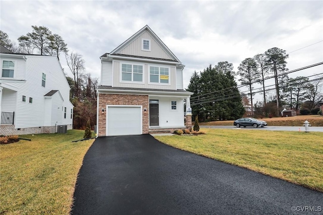 view of front of home featuring central AC unit, a garage, and a front lawn