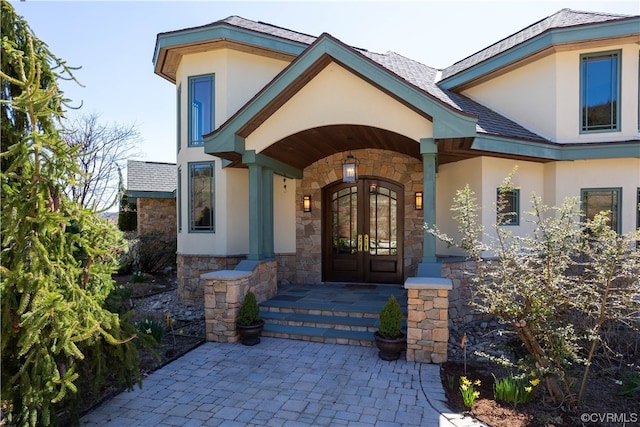 property entrance featuring french doors