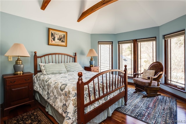 bedroom featuring multiple windows, dark wood-type flooring, and lofted ceiling with beams