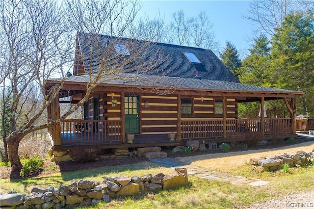 log-style house with a porch