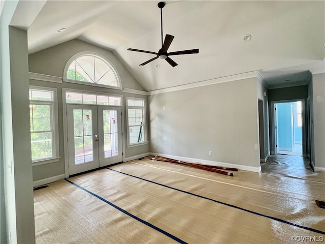 interior space with ceiling fan, lofted ceiling, french doors, and a healthy amount of sunlight