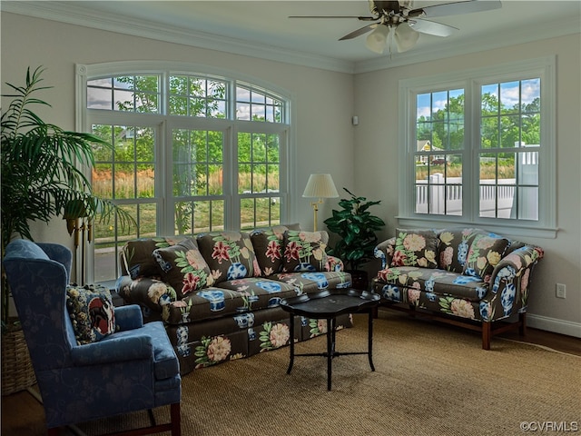 living room with ornamental molding, a healthy amount of sunlight, ceiling fan, and hardwood / wood-style flooring