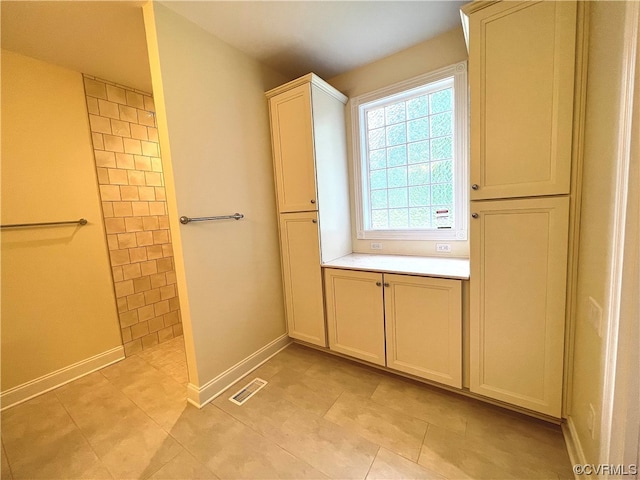 bathroom featuring vanity and tile patterned flooring