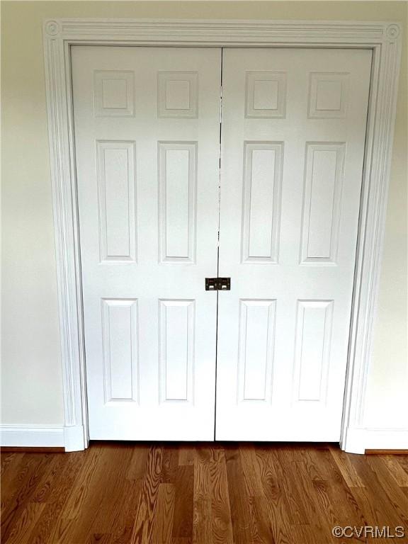 details featuring baseboards and wood finished floors