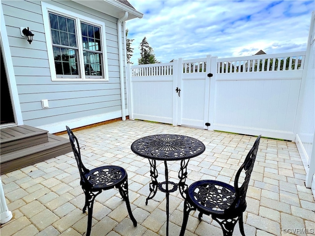 view of patio / terrace featuring fence