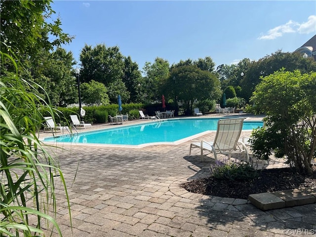 community pool featuring a patio area