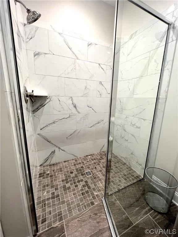 bathroom with a shower stall