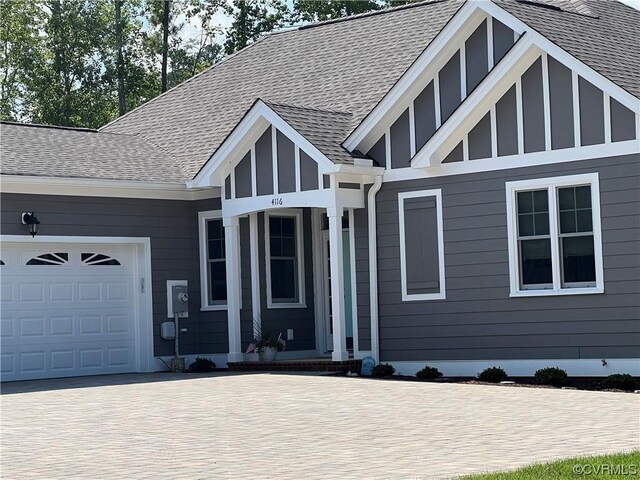 tudor house featuring a garage