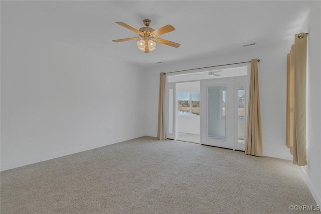 unfurnished room with light carpet and ceiling fan