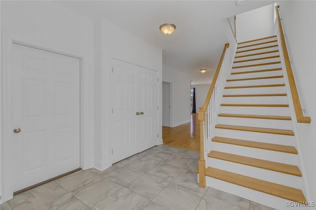 interior space featuring marble finish floor