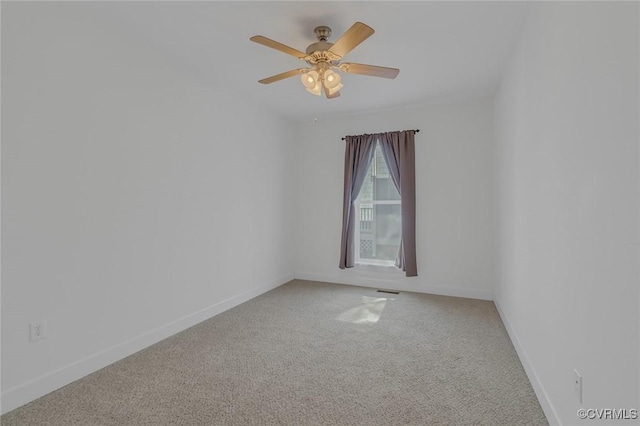 unfurnished room featuring carpet floors, ceiling fan, and baseboards